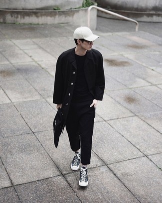 Black Canvas Tote Bag Outfits For Men: A black raincoat and a black canvas tote bag are absolute staples if you're picking out an off-duty wardrobe that matches up to the highest menswear standards. Feeling adventerous? Mix things up a bit with black and white canvas high top sneakers.
