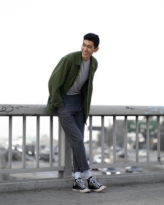 Dark Green Raincoat Outfits For Men: A dark green raincoat and charcoal vertical striped chinos are absolute menswear essentials that will integrate nicely within your casual styling collection. And if you want to easily play down this getup with a pair of shoes, introduce a pair of black and white canvas high top sneakers to your look.