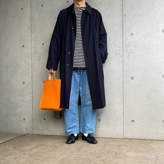 Men's Outfits 2021: Pair a navy raincoat with light blue jeans to put together a laid-back and cool outfit. Introduce black leather tassel loafers to the equation to immediately step up the style factor of any look.