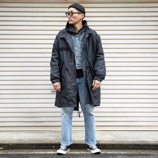 Black Raincoat Outfits For Men: Perfect the laid-back and cool outfit in a black raincoat and light blue jeans. Balance out this ensemble with more laid-back shoes, like these navy and white canvas high top sneakers.
