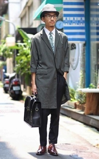 Grey Raincoat Outfits For Men: A grey raincoat and black chinos are a pairing that every fashionable gentleman should have in his off-duty arsenal. For footwear, you can go down a classier route with a pair of burgundy leather oxford shoes.