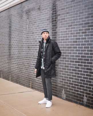 Grey Wool Chinos Outfits: Reach for a black raincoat and grey wool chinos for both seriously stylish and easy-to-wear look. On the shoe front, this ensemble is complemented brilliantly with white canvas low top sneakers.