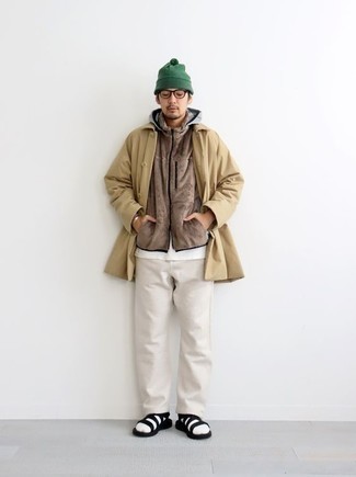 Tan Raincoat Outfits For Men: For sharp menswear style without the need to sacrifice on practicality, we like this combination of a tan raincoat and white chinos. Go ahead and complement this getup with black canvas sandals for a dash of stylish nonchalance.