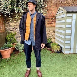 Gilet Outfits For Men: If you enjoy a more casual approach to fashion, why not make a gilet and navy jeans your outfit choice? A pair of brown leather desert boots looks great here.