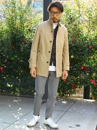 Tan Raincoat Outfits For Men: A tan raincoat and grey chinos make for the ultimate relaxed look for any gentleman. When not sure as to the footwear, stick to white canvas low top sneakers.