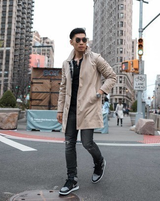 Charcoal Ripped Jeans Outfits For Men: Consider wearing a beige raincoat and charcoal ripped jeans for a relaxed casual ensemble with an edgy spin. We're totally digging how this whole getup comes together thanks to black leather high top sneakers.