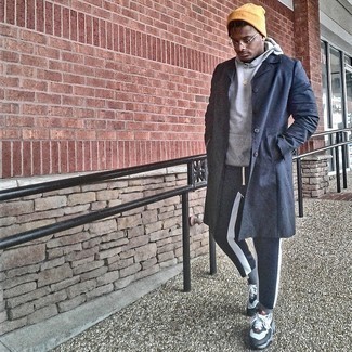 Mustard Beanie Outfits For Men: Want to inject your menswear arsenal with some bold casual menswear style? Consider wearing a navy raincoat and a mustard beanie. The whole look comes together when you complete this ensemble with white and black athletic shoes.
