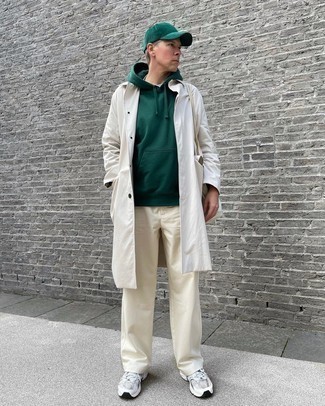 White Raincoat Outfits For Men: This off-duty combination of a white raincoat and beige chinos is super easy to throw together in seconds time, helping you look stylish and prepared for anything without spending too much time rummaging through your wardrobe. Not sure how to finish off? Add silver athletic shoes for a more casual finish.
