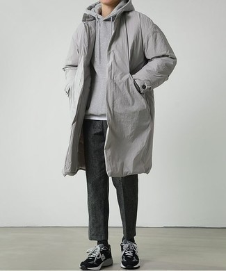 Charcoal Raincoat Outfits For Men: A charcoal raincoat and charcoal wool chinos are the kind of a tested casual getup that you so terribly need when you have zero time to dress up. Black suede low top sneakers look great complementing your ensemble.