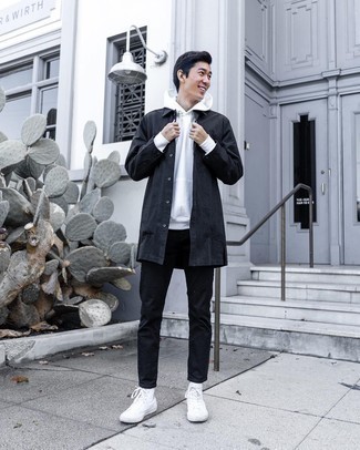 Black Raincoat Outfits For Men: This combination of a black raincoat and black jeans is very versatile and up for whatever's on your to-do list today. Add white canvas high top sneakers to the mix to inject a sense of stylish casualness into this getup.