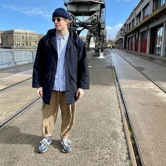 Coat Outfits For Men: This laid-back pairing of a coat and khaki corduroy chinos is a safe bet when you need to look cool and relaxed in a flash. Navy and white athletic shoes are very appropriate here.