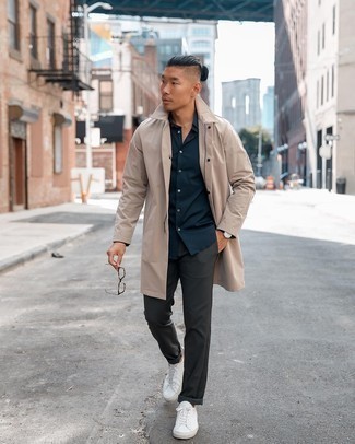 Beige Raincoat Outfits For Men: Breathe new life into your current casual rotation with a beige raincoat and charcoal chinos. White canvas low top sneakers pull the ensemble together.