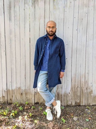 Blue Long Sleeve Shirt Outfits For Men: Wear a blue long sleeve shirt and light blue jeans to pull together a really sharp and modern-looking off-duty ensemble. Complete your getup with a pair of white canvas low top sneakers for maximum impact.