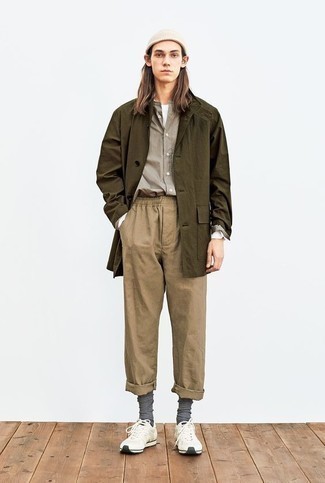 Chinos Outfits: If the situation allows relaxed dressing, you can rock an olive raincoat and chinos. Avoid looking overdressed by finishing off with a pair of white athletic shoes.