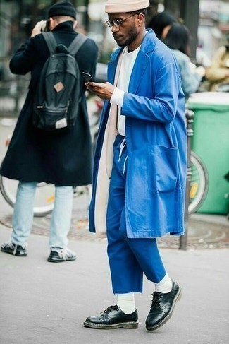 Navy Raincoat Outfits For Men: This laid-back combination of a navy raincoat and blue chinos is a surefire option when you need to look casually stylish but have no extra time to spare. Inject this ensemble with an air of class with a pair of black leather derby shoes.