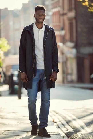Black Raincoat Outfits For Men: This combination of a black raincoat and blue jeans looks put together and instantly makes you look sharp. Dark brown suede desert boots will put a different spin on this look.