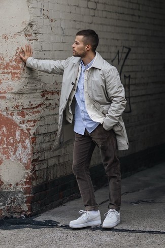 Brown Corduroy Chinos Outfits In Their 20s: Reach for a grey raincoat and brown corduroy chinos if you wish to look casually cool without spending too much time. Our favorite of a myriad of ways to finish off this ensemble is a pair of beige leather low top sneakers. Guys who are curious how to wear edgy off-duty style in your twenties, this pairing should answer your question.