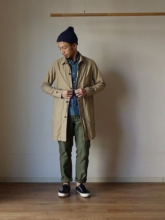 Tan Raincoat Outfits For Men: For an ensemble that offers function and fashion, wear a tan raincoat with olive chinos. When not sure as to the footwear, stick to a pair of black canvas low top sneakers.