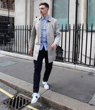 White and Red Leather Low Top Sneakers Outfits For Men: You'll be amazed at how extremely easy it is for any guy to get dressed this way. Just a grey raincoat married with navy chinos. A pair of white and red leather low top sneakers is a great pick to complete this ensemble.