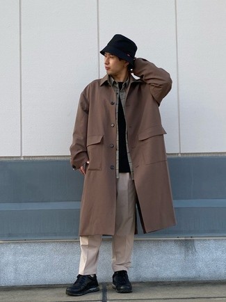 Brown Raincoat Outfits For Men: Team a brown raincoat with beige chinos for relaxed dressing with a contemporary spin. For times when this ensemble looks too fancy, play it down by wearing black athletic shoes.