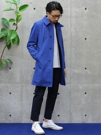 Navy Raincoat Outfits For Men: Teaming a navy raincoat and a navy suit is a fail-safe way to inject your closet with some manly sophistication. Take an otherwise standard look in a sportier direction by wearing white canvas low top sneakers.