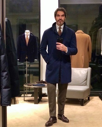 Navy Coat Outfits For Men: To look like a stylish dandy at all times, go for a navy coat and a brown suit. Add a pair of dark brown leather tassel loafers to this look to easily boost the wow factor of any ensemble.