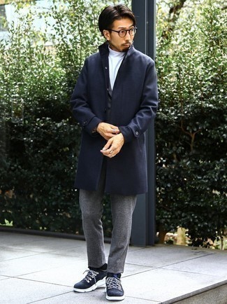 Navy Raincoat Outfits For Men: A navy raincoat and a grey wool suit are among the crucial elements of any good closet. Our favorite of an endless number of ways to complete this look is a pair of navy and white athletic shoes.