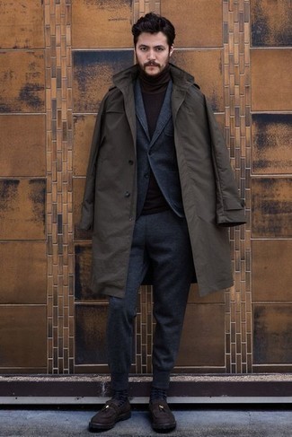 Brown Raincoat Outfits For Men: A brown raincoat and a charcoal wool suit are absolute staples if you're crafting an elegant closet that matches up to the highest men's fashion standards. If you want to break out of the mold a little, introduce dark brown suede tassel loafers to the mix.