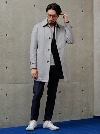 Grey Raincoat Outfits For Men: This polished combo of a grey raincoat and a navy suit is a favored choice among the dapper gentlemen. White canvas low top sneakers are a guaranteed way to bring an air of stylish effortlessness to this outfit.