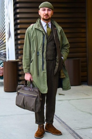 Dark Green Beanie Outfits For Men: Demonstrate your expertise in menswear styling in this city casual combination of an olive raincoat and a dark green beanie. If you need to effortlessly bump up your ensemble with one item, choose a pair of tobacco suede desert boots.