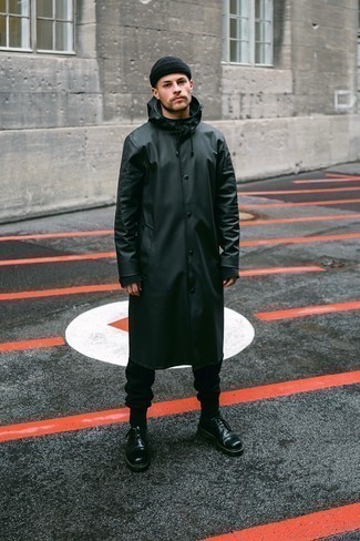 Black Raincoat Outfits For Men: You'll be amazed at how very easy it is for any gent to put together a relaxed look like this. Just a black raincoat worn with black sweatpants. You can get a bit experimental with footwear and complete this ensemble with black leather derby shoes.
