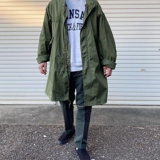 Black Canvas Slip-on Sneakers Outfits For Men: For a look that's very simple but can be modified in a variety of different ways, opt for an olive raincoat and dark green chinos. We're totally digging how cohesive this outfit looks when finished off with black canvas slip-on sneakers.