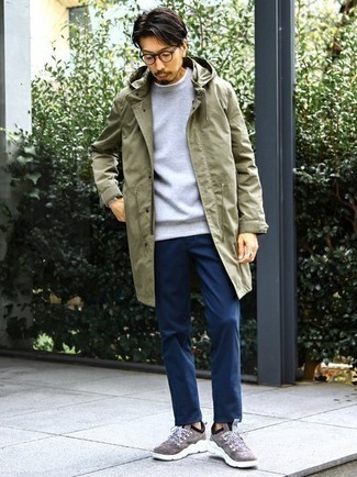 Olive Raincoat Outfits For Men: This pairing of an olive raincoat and navy chinos is solid proof that a simple casual outfit doesn't have to be boring. To infuse a more laid-back spin into your outfit, introduce a pair of brown athletic shoes to the equation.