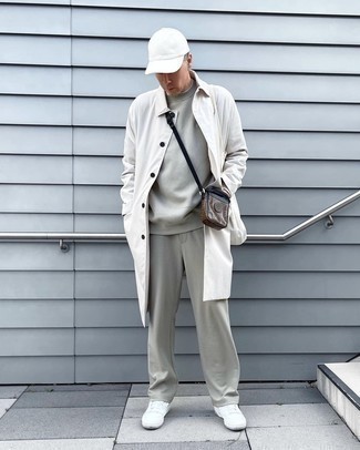 White Coat Outfits For Men: A white coat and a grey track suit are among the crucial elements in any modern gentleman's properly balanced casual arsenal. Add white leather low top sneakers to the mix to instantly up the style factor of any look.