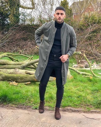 Grey Raincoat Outfits For Men: This off-duty pairing of a grey raincoat and black ripped skinny jeans is super easy to pull together in no time flat, helping you look stylish and prepared for anything without spending a ton of time digging through your wardrobe. Throw brown suede chelsea boots into the mix to instantly rev up the classy factor of your outfit.