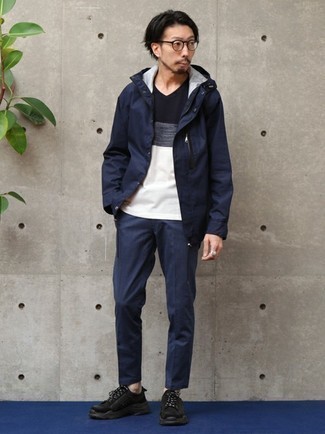 Black and Blue Athletic Shoes Outfits For Men: This casual combination of a navy raincoat and navy chinos is super easy to throw together without a second thought, helping you look dapper and prepared for anything without spending a ton of time digging through your wardrobe. Serve a little mix-and-match magic by rocking a pair of black and blue athletic shoes.