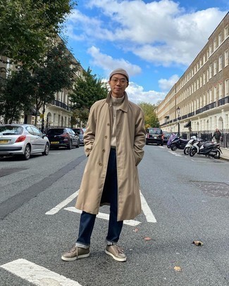 Men's Outfits 2021: This casual combination of a tan raincoat and navy jeans can take on different moods depending on the way you style it. Complement your ensemble with brown leather low top sneakers and the whole look will come together wonderfully.