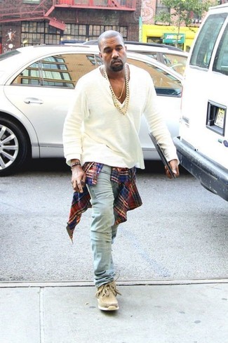 Kanye West wearing Red and Navy Plaid Long Sleeve Shirt, White Long Sleeve Henley Shirt, Light Blue Jeans, Tan Suede Desert Boots