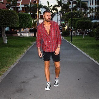 Red and White Plaid Long Sleeve Shirt Outfits For Men: This combination of a red and white plaid long sleeve shirt and black denim shorts is solid proof that a safe casual look doesn't have to be boring. In the shoe department, go for something on the relaxed end of the spectrum by finishing off with black and white canvas high top sneakers.
