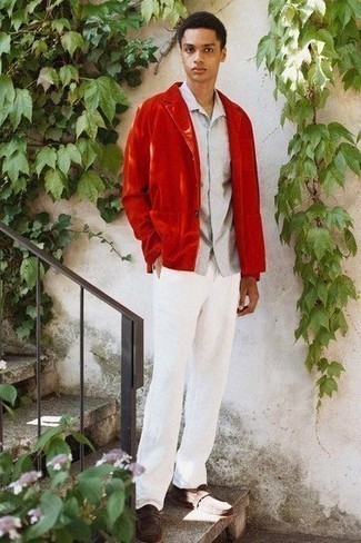 Men's Outfits 2022: Prove that you do classic and casual menswear like an expert in men's style by wearing a red corduroy blazer and white chinos. For something more on the classy side to complement your getup, introduce dark brown suede loafers to this outfit.