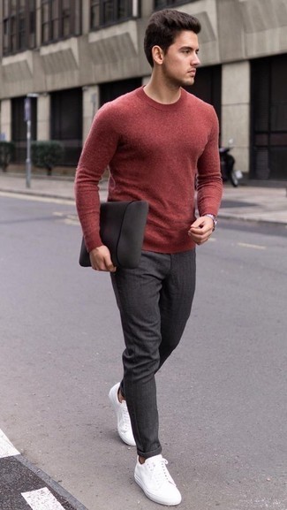Red Crew-neck Sweater Outfits For Men: Go for a straightforward but at the same time casual and cool choice pairing a red crew-neck sweater and charcoal chinos. Let your outfit coordination chops really shine by complementing this outfit with white leather low top sneakers.