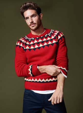 Red Fair Isle Crew-neck Sweater Outfits For Men: To create a casual menswear style with a contemporary spin, you can go for a red fair isle crew-neck sweater and navy chinos.
