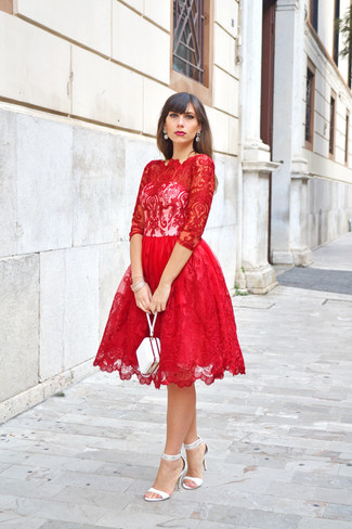 White Clutch Outfits: Why not try pairing a red lace fit and flare dress with a white clutch? Both of these items are very practical and look cool when worn together. A pair of white leather heeled sandals immediately amps up the oomph factor of this look.