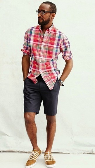 Mustard Low Top Sneakers Outfits For Men: This combo of a red plaid long sleeve shirt and charcoal shorts is the ultimate casual ensemble for today's man. Mustard low top sneakers finish off this outfit very well.