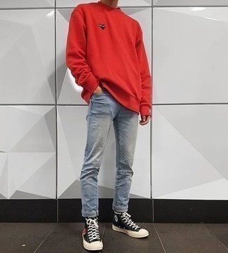 Black and White High Top Sneakers Outfits For Men: A red sweatshirt and light blue jeans are an easy way to infuse effortless cool into your casual arsenal. To give this outfit a more casual spin, why not add black and white high top sneakers to this look?