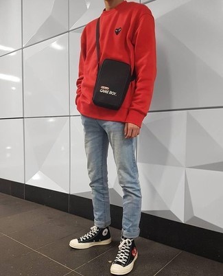 Red Sweatshirt Outfits For Men: A red sweatshirt and light blue jeans are a great combo to add to your casual rotation. Complement your look with black and white canvas high top sneakers to make the getup current.