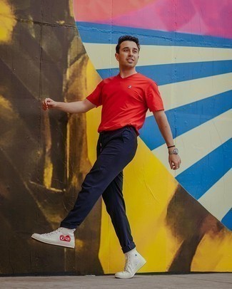 Red V-neck T-shirt Outfits For Men: A red v-neck t-shirt looks so great when paired with navy chinos in an off-duty outfit. Add a little kick to the ensemble with a pair of white print canvas high top sneakers.