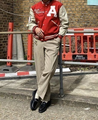 Red and White Varsity Jacket Outfits For Men: If you wish take your off-duty look to a new height, opt for a red and white varsity jacket and beige chinos. For something more on the dressier end to complete this ensemble, opt for a pair of black leather loafers.