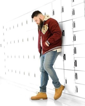 Red and White Varsity Jacket Outfits For Men: Team a red and white varsity jacket with light blue jeans for both seriously stylish and easy-to-achieve look. To add a touch of stylish effortlessness to your ensemble, add a pair of tan suede work boots to the mix.