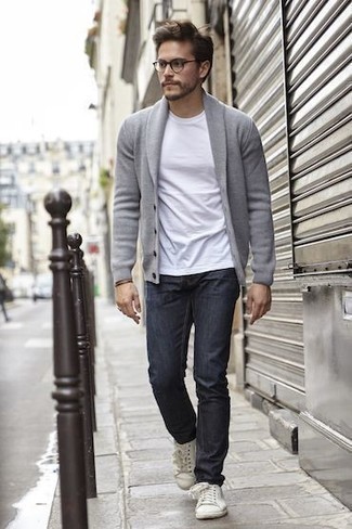 Grey Shawl Cardigan Outfits For Men: Marry a grey shawl cardigan with navy jeans for a fuss-free ensemble that's also put together. A great pair of white canvas low top sneakers is an easy way to upgrade this look.